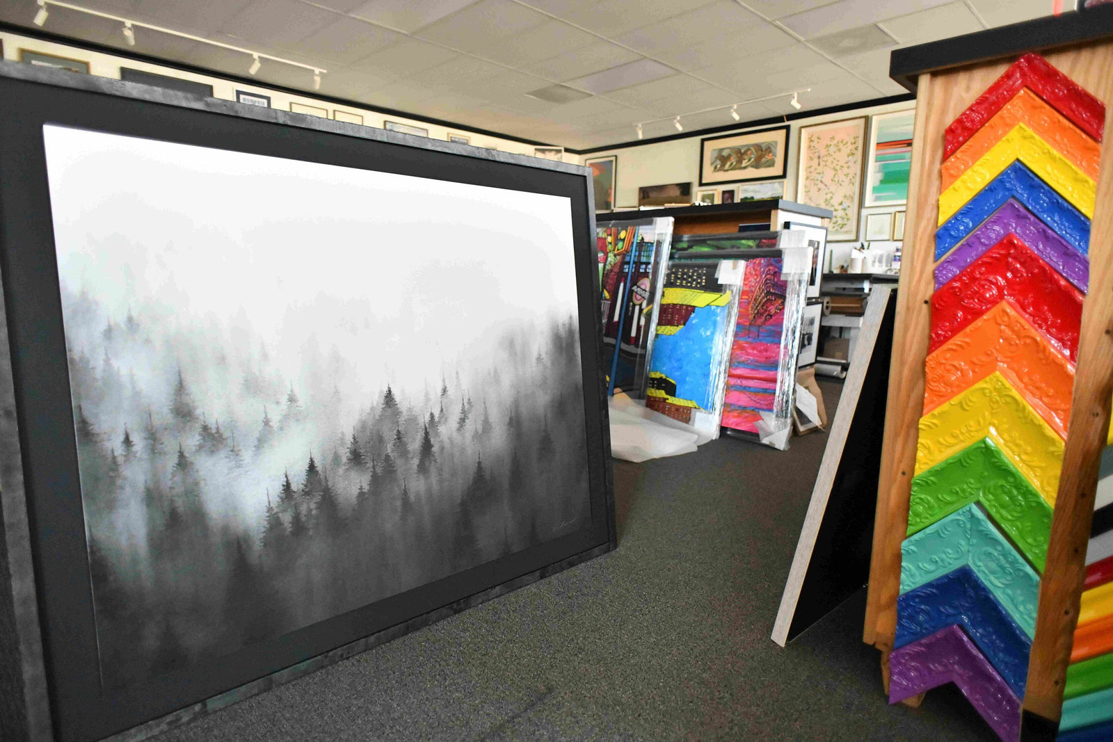 Frame Corner custom frame store showcasing a framed artwork and colorful frame options
